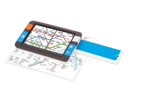 Small device resembling a smartphone or small tablet, laying atop a printed map. The device screen is displaying a magnified view of the map. The device is black, with four menu buttons on either side of the screen.
