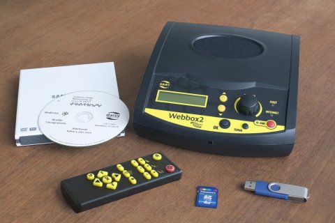 Webbox2 with remote control, CD, manual, USB, and SD card.