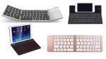 Various models of folding keyboards. They resemble thin, smaller versions of standard keyboards without a numeric keypad on the right-hand side. They have a two-fold or three-fold design, with hinges and the ability to fold flat similar to a "flip phone." The hinges on one model are visibly obvious when keyboard is in use. The other models' hinges are not noticeable. Two devices include a built-in tablet stand at the top. Two models are black; One is silver with black keys; the fourth is rose gold.